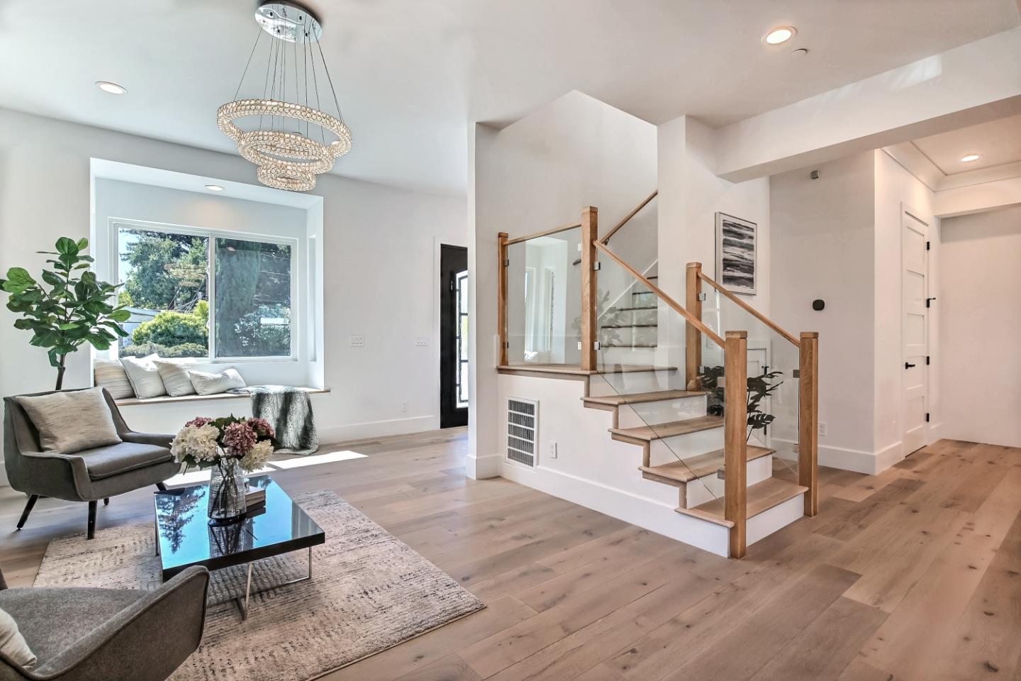 10732 Culbertson Drive Cupertino, CA 95014 - Photo 4 of 36 a living room with furniture and a chandelier
