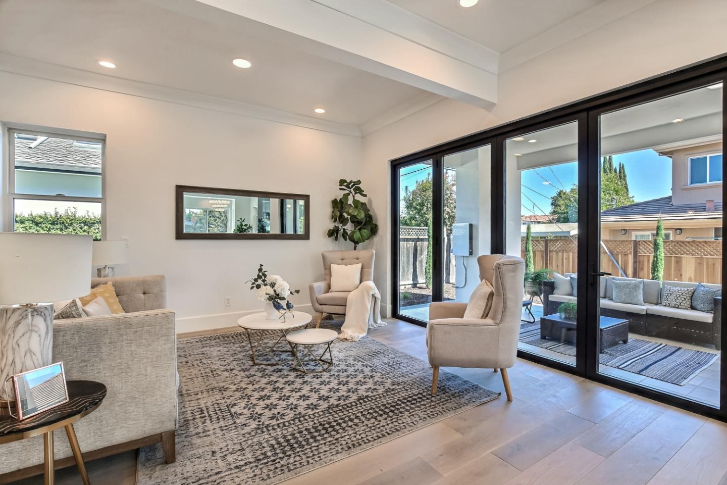 10732 Culbertson Drive Cupertino, CA 95014 - Photo 6 of 36 a living room with furniture and a large window