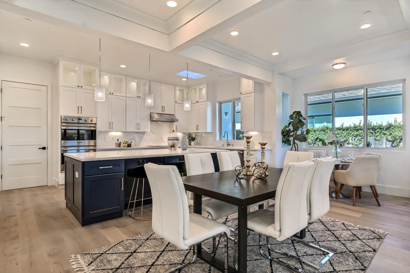 10732 Culbertson Drive Cupertino, CA 95014 - Photo 8 of 36 a view of kitchen with dining area cabinets and chairs