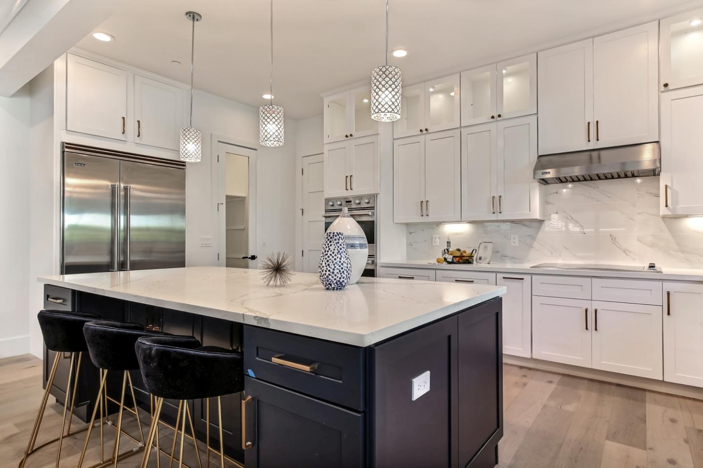 10732 Culbertson Drive Cupertino, CA 95014 - Photo 9 of 36 a kitchen with kitchen island granite countertop a sink cabinets and stainless steel appliances