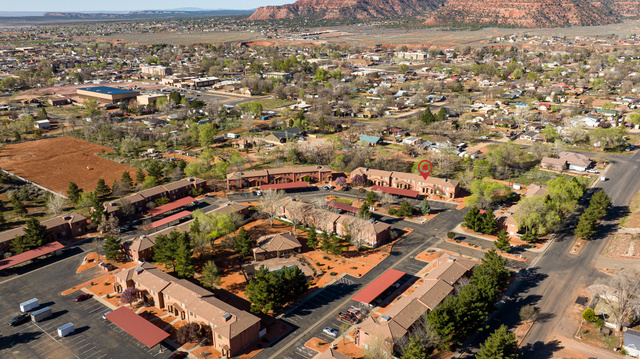 6 300th Road North, Unit I6 Kanab, UT 84741 - Photo 7 of 37 Aerial overview of property's location with a mountainous background and nearby suburban area