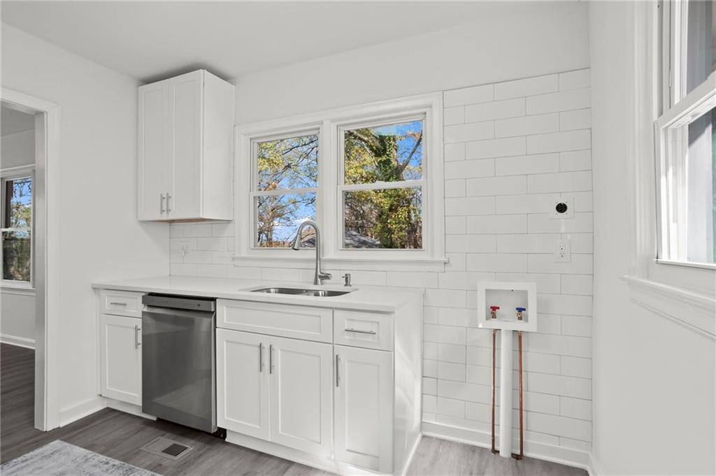 502 Alpine Way Marietta, GA 30062 - Photo 11 of 21 a kitchen with white cabinets and window