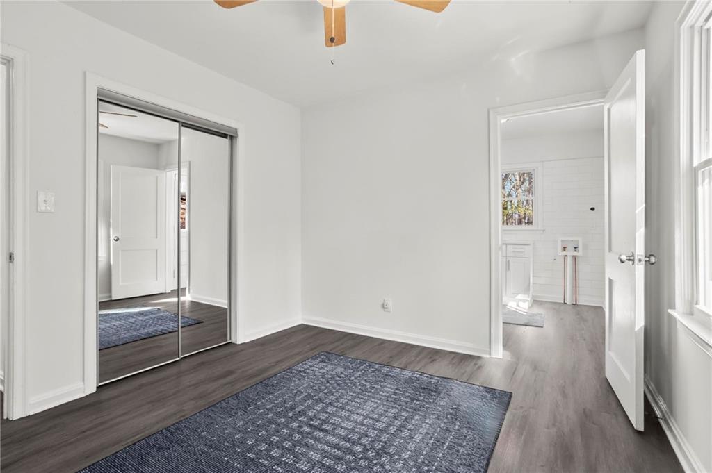 502 Alpine Way Marietta, GA 30062 - Photo 15 of 21 an empty room with wooden floor and windows