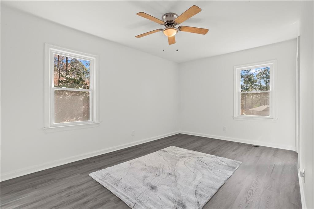 502 Alpine Way Marietta, GA 30062 - Photo 16 of 21 an empty room with wooden floor and window