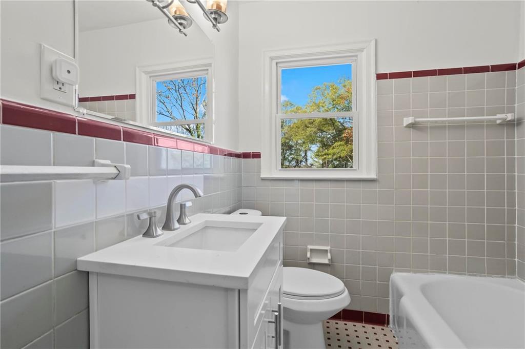502 Alpine Way Marietta, GA 30062 - Photo 20 of 21 a bathroom with a sink a toilet and a mirror