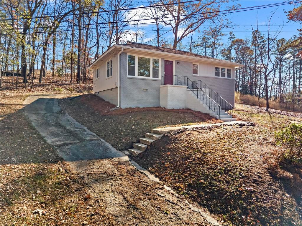 502 Alpine Way Marietta, GA 30062 - Photo 2 of 21 a front view of a house with a yard covered in snow