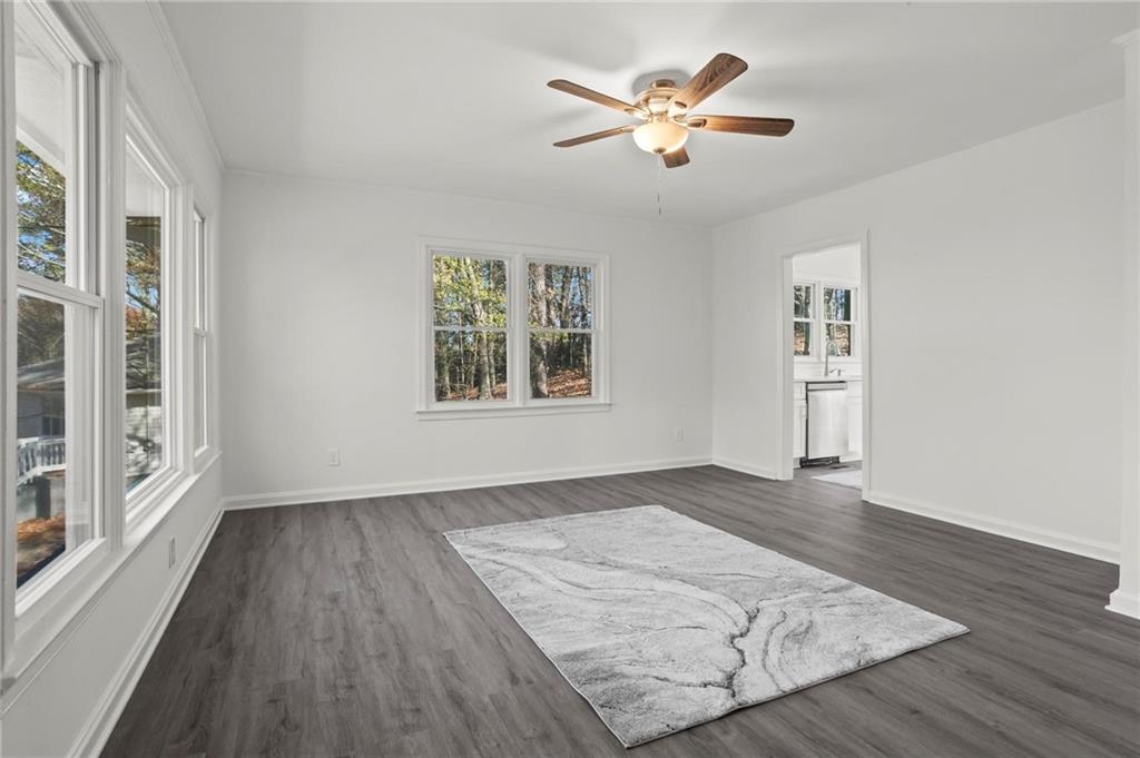 502 Alpine Way Marietta, GA 30062 - Photo 6 of 21 wooden floor in an empty room with a window