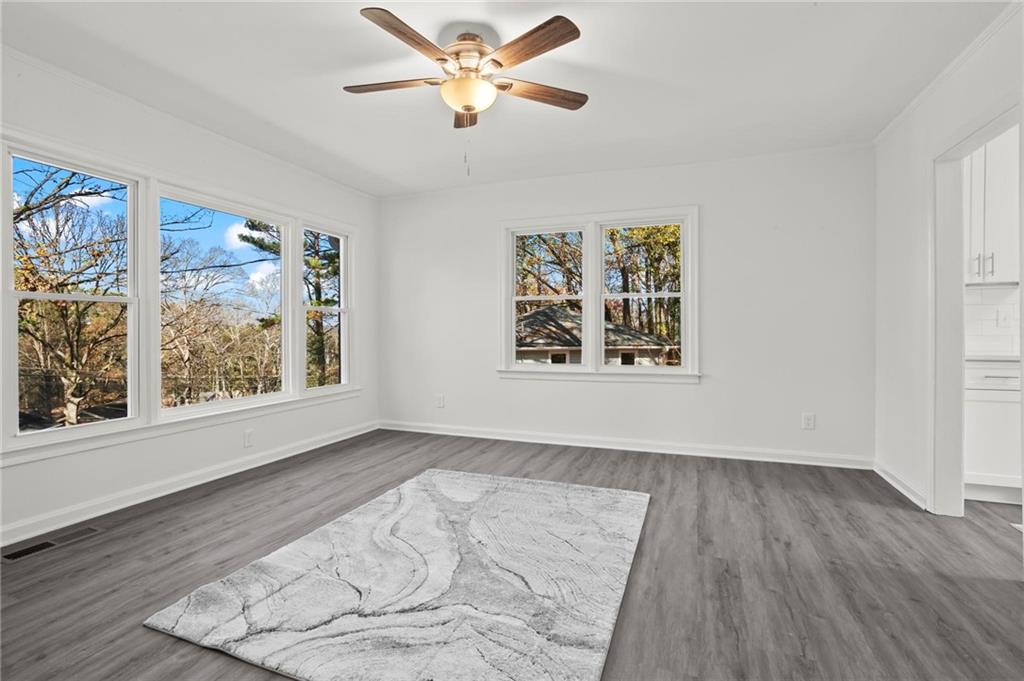 502 Alpine Way Marietta, GA 30062 - Photo 7 of 21 wooden floor in an empty room with a window