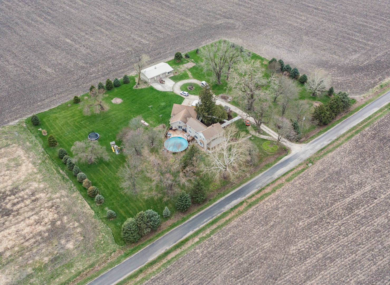 3185 South Hadden Road Verona, IL 60479 - Photo 35 of 39 a view of a garden with a bench
