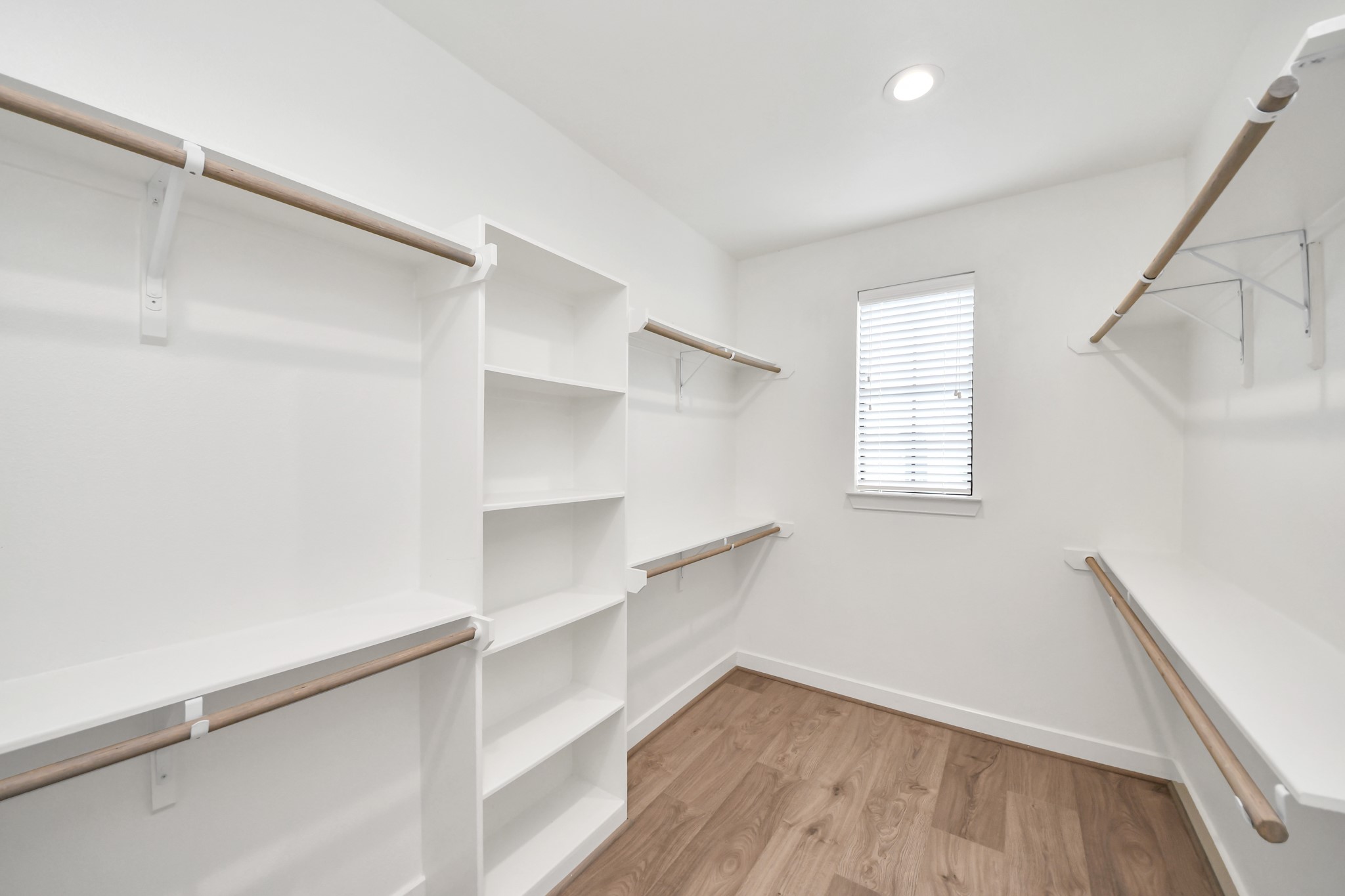 2114 Stuart Street Houston, TX 77004 - Photo 30 of 39 a view of walk in closet with empty racks