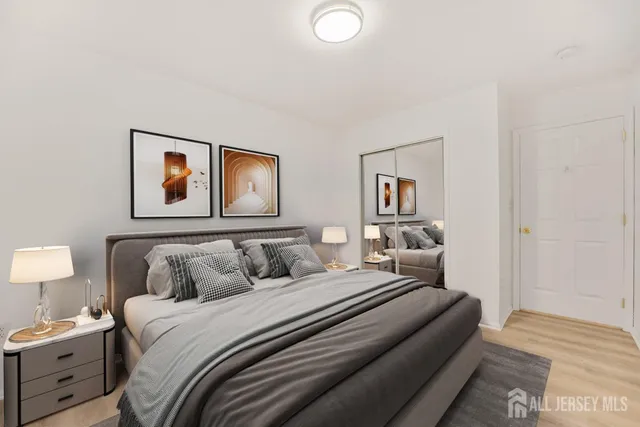 a bedroom with a bed and lamp