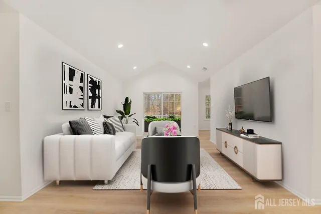 a living room with furniture and a flat screen tv