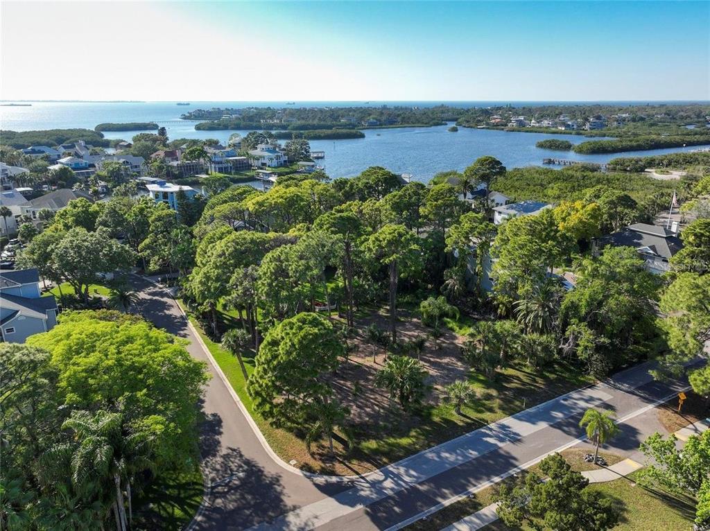 an aerial view of a houses with a yard