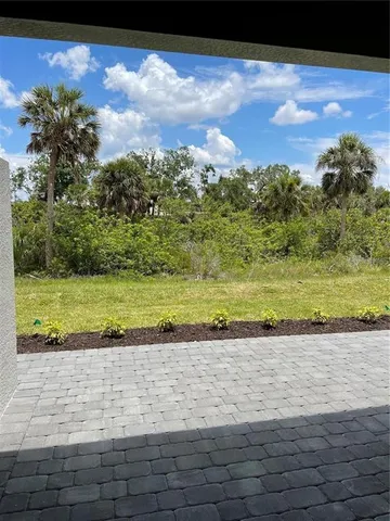 a view of a yard with an outdoor space