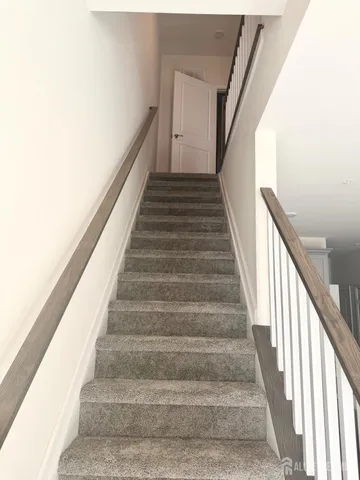 a view of a hallway with staircase