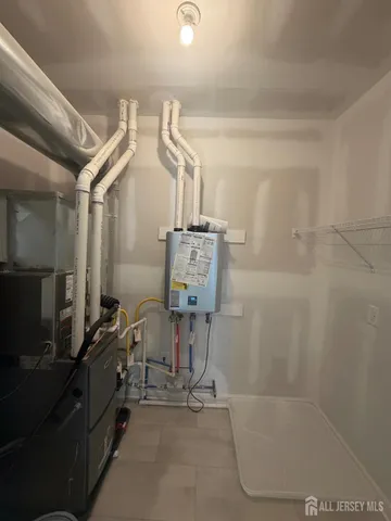 a bathroom with a granite countertop sink a toilet a mirror and bathtub