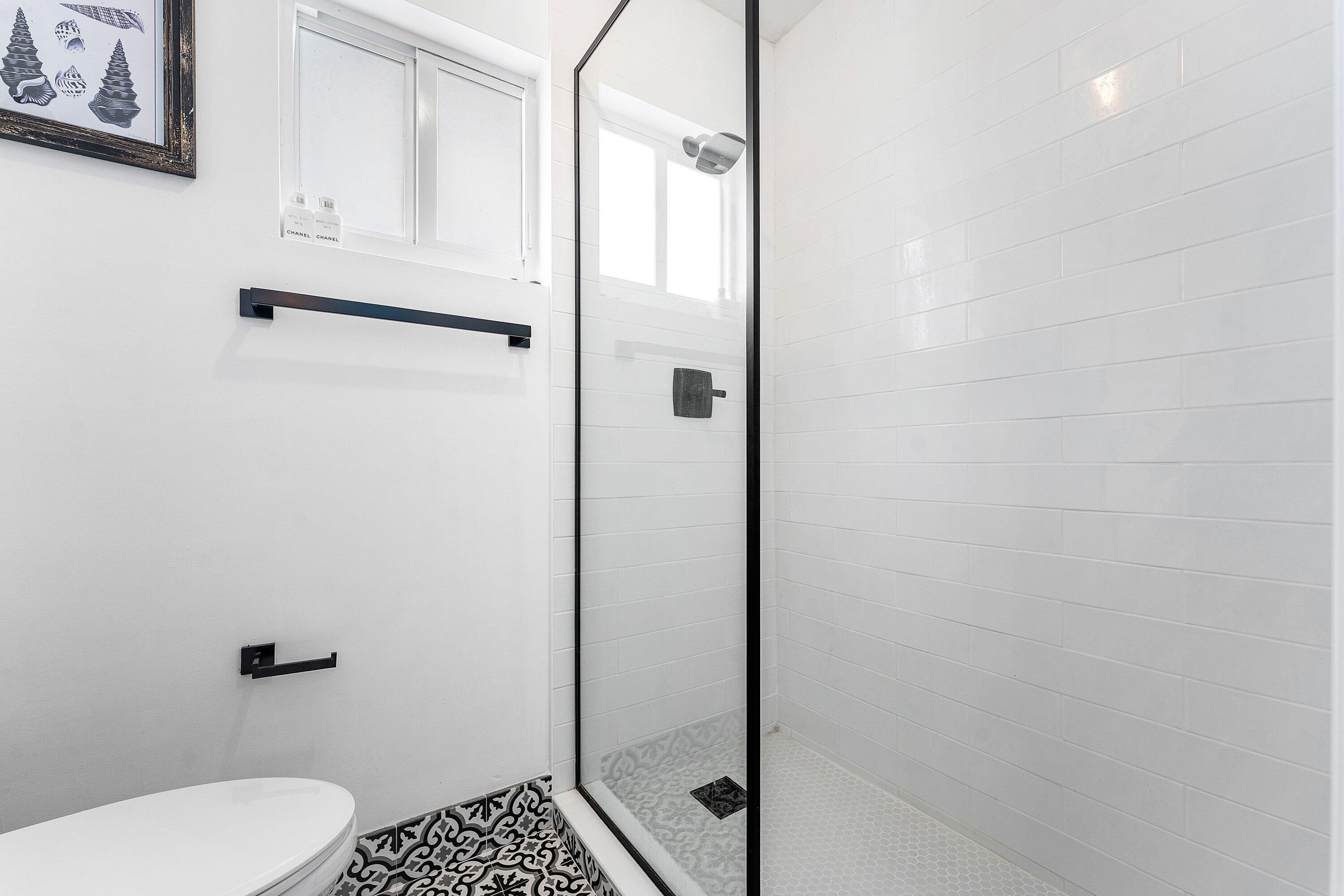 581 Northwest 13th Drive Boca Raton, FL 33486 - Photo 32 of 39 a bathroom with a shower and toilet