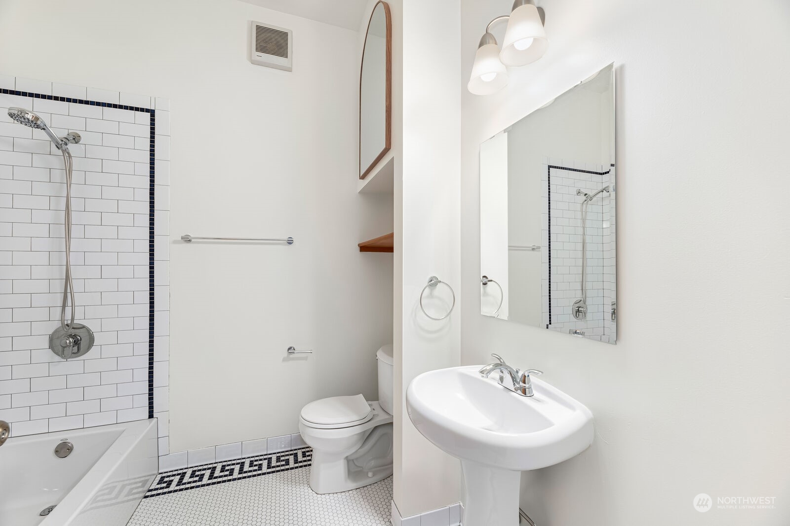 22 John Street, Unit 6 Seattle, WA 98109 - Photo 11 of 17 a bathroom with a sink toilet and shower
