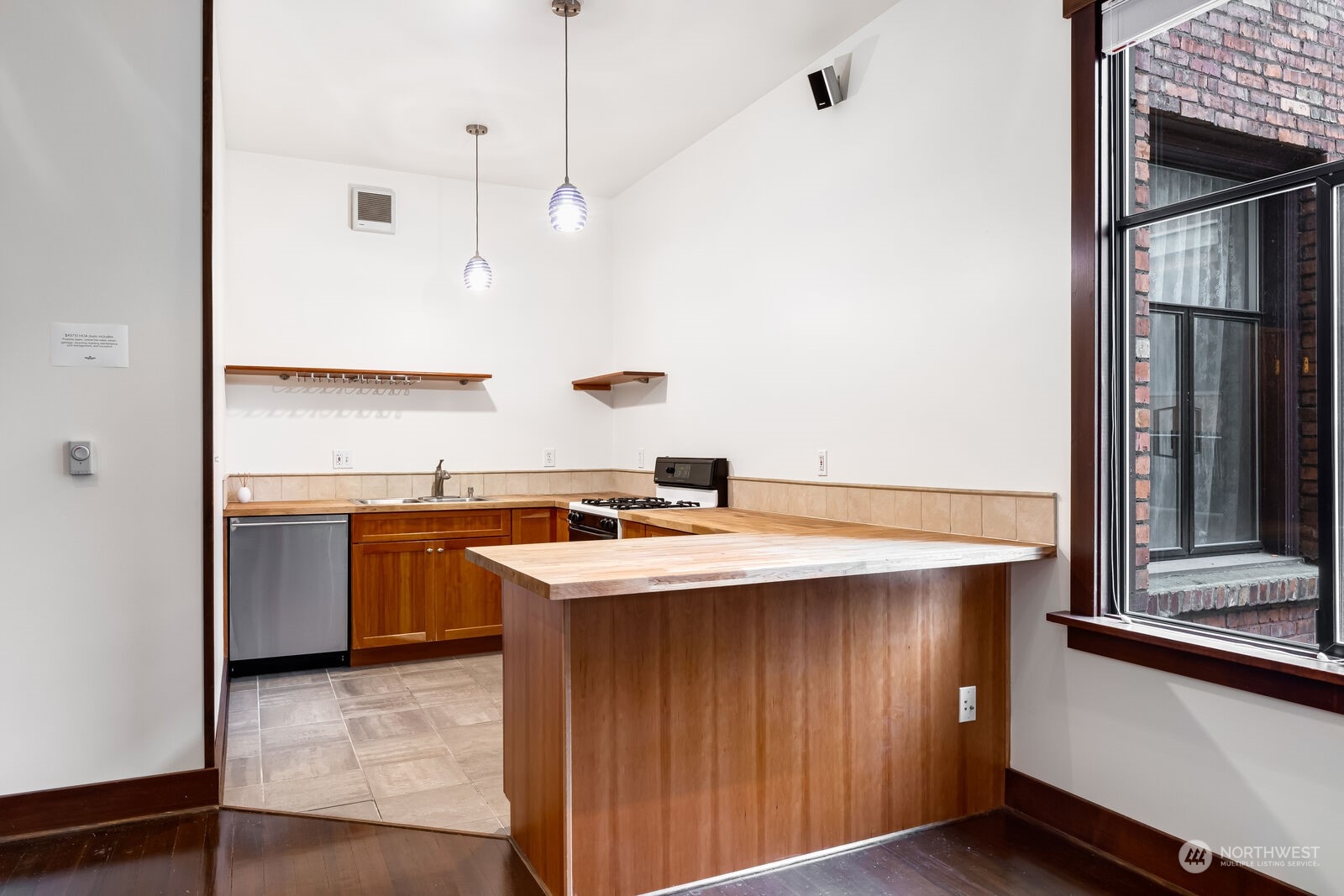 22 John Street, Unit 6 Seattle, WA 98109 - Photo 8 of 17 a kitchen with a sink a stove and a refrigerator