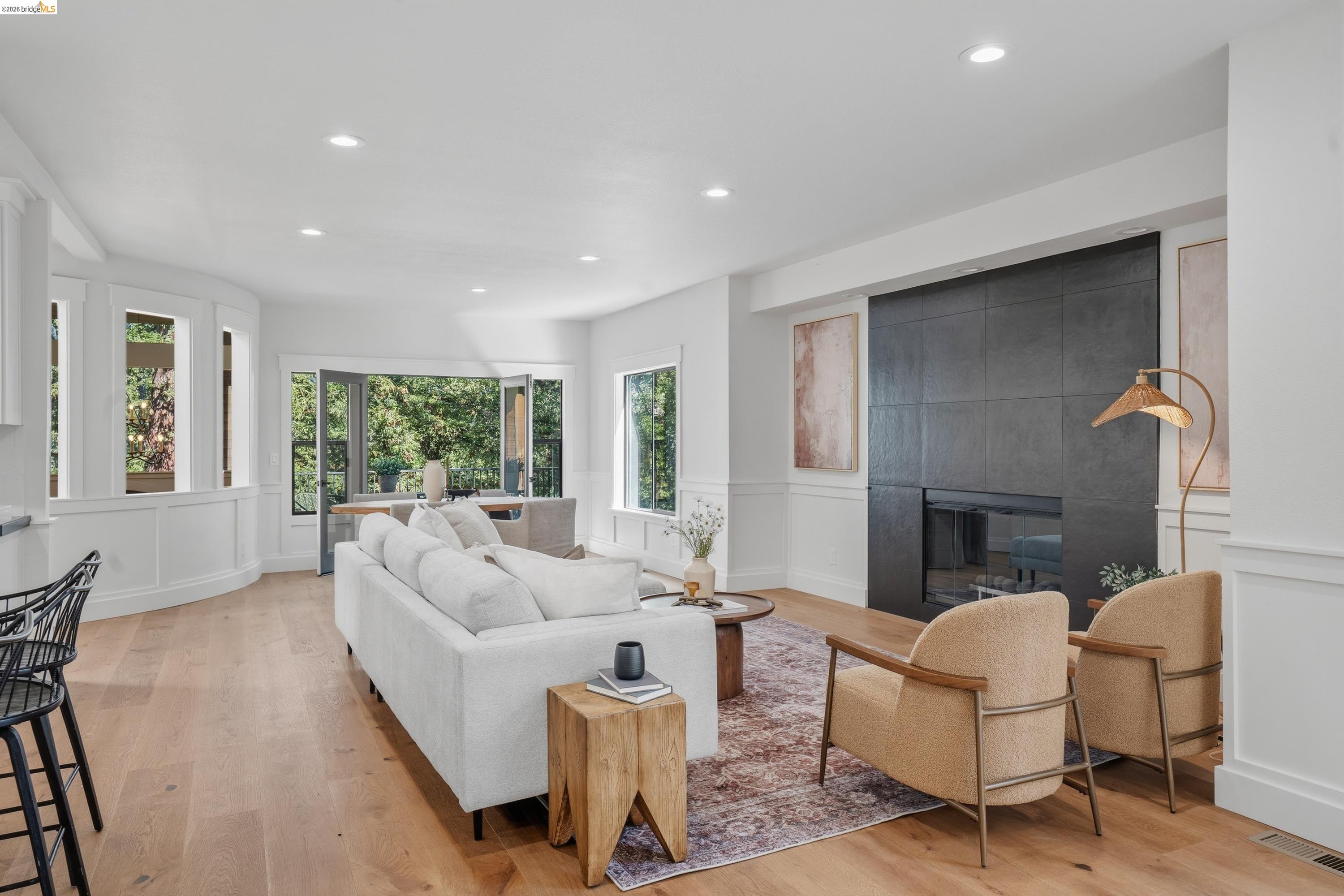 4120 Happy Valley Road Lafayette, CA 94549 - Photo 9 of 48 Open-concept living space featuring wood-finish flooring, recessed lighting, and white wainscoting