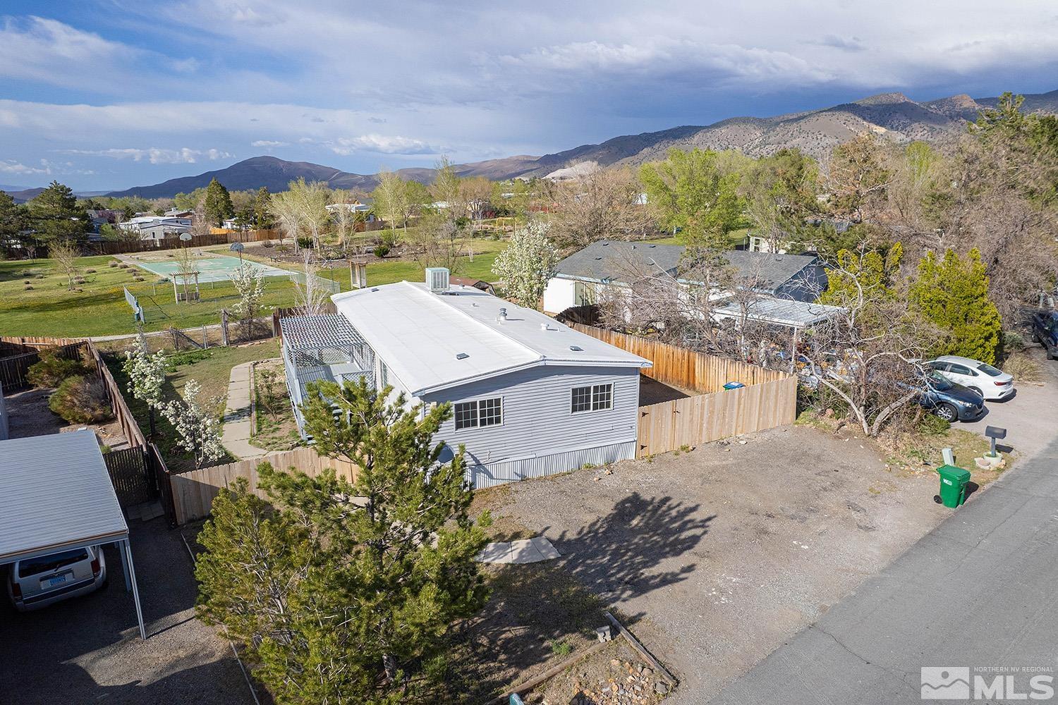 an aerial view of a house with a big yard