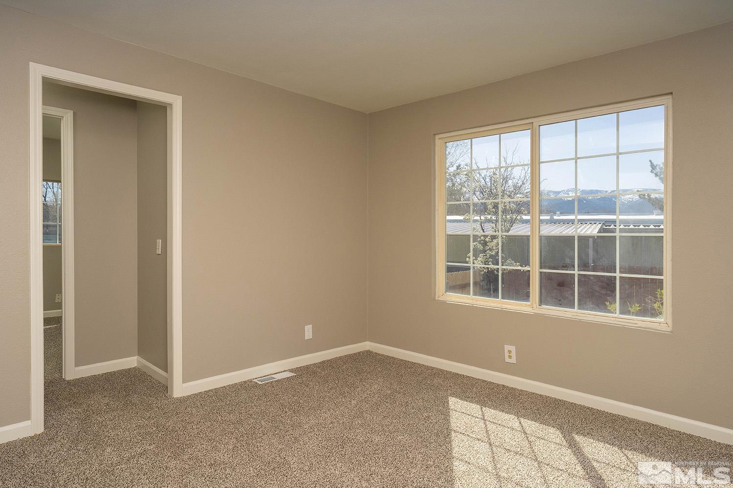 16310 Enargite Circle Reno, NV 89521 - Photo 11 of 32 a view of an empty room with a window
