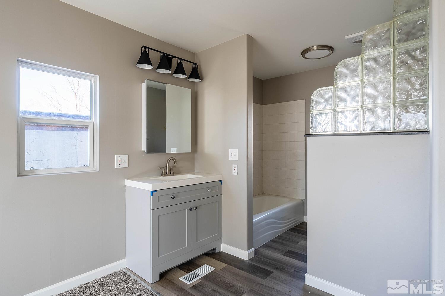 16310 Enargite Circle Reno, NV 89521 - Photo 14 of 32 a bathroom with a sink and a mirror