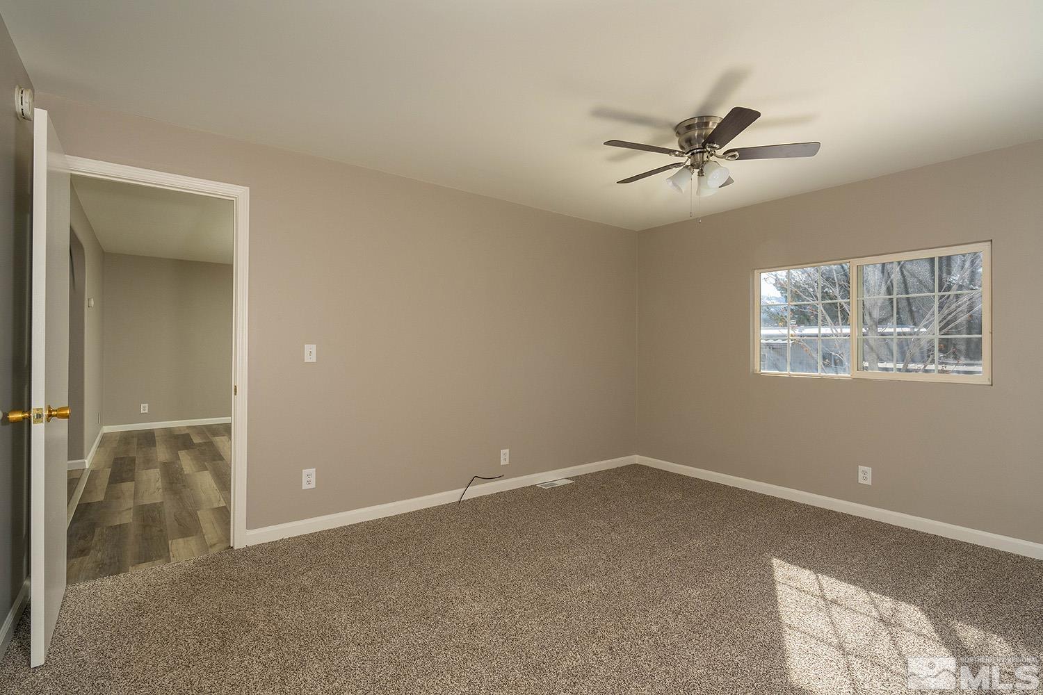 16310 Enargite Circle Reno, NV 89521 - Photo 16 of 32 a view of a small space with wooden floor and a window