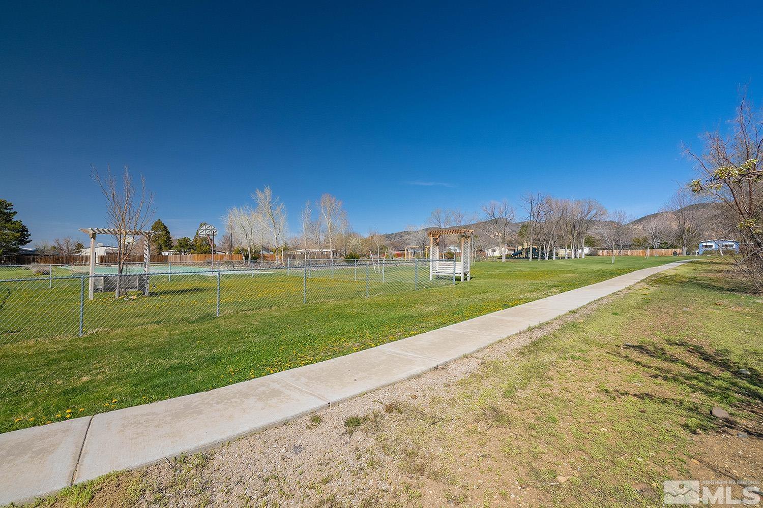 16310 Enargite Circle Reno, NV 89521 - Photo 27 of 32 a view of a golf course with a lake