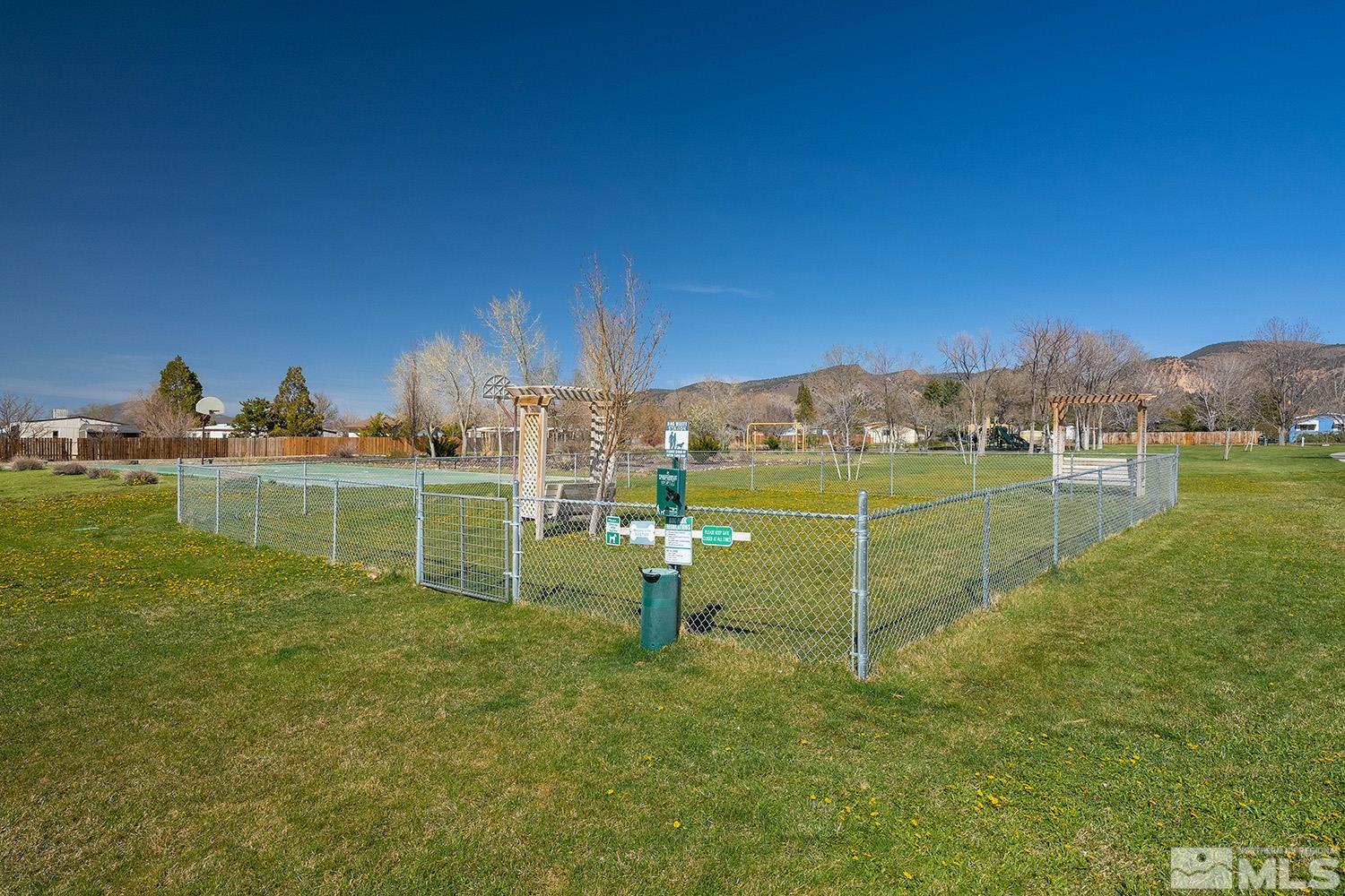 16310 Enargite Circle Reno, NV 89521 - Photo 29 of 32 a view of a lake with a building in the background