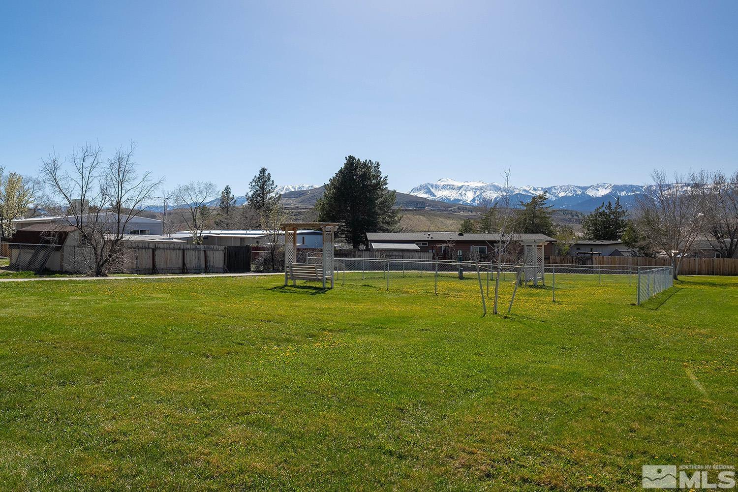 16310 Enargite Circle Reno, NV 89521 - Photo 31 of 32 a view of a swimming pool with a yard