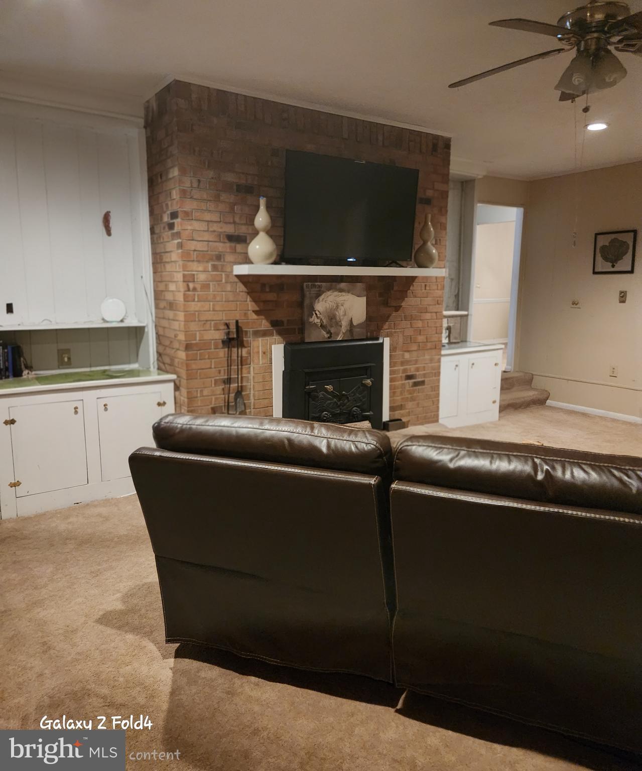 6810 Robinia Road Temple Hills, MD 20748 - Photo 6 of 15 a living room with a fireplace