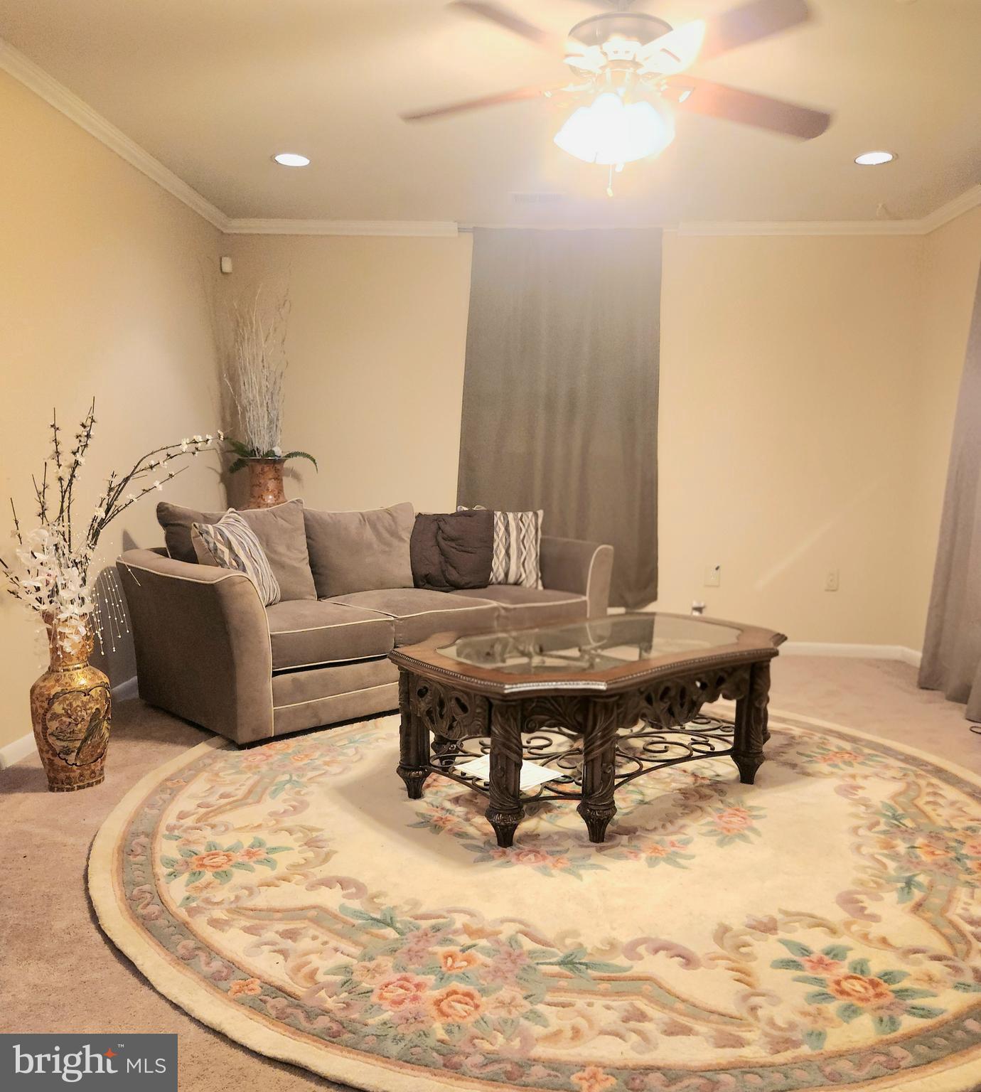 6810 Robinia Road Temple Hills, MD 20748 - Photo 9 of 15 a living room with furniture and a table