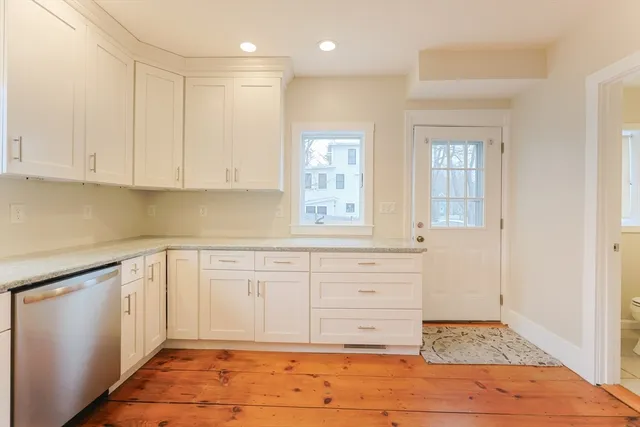 a bathroom with a sink a mirror and a shower