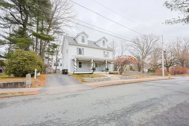 a view of a house with a snow on the road
