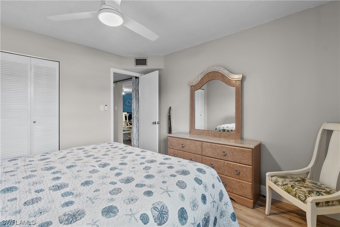 7031 New Post Road, Unit 4 North Fort Myers, FL 33917 - Photo 18 of 39 a bedroom with a bed and a dresser