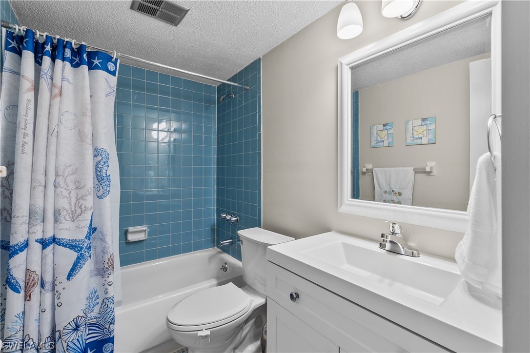 7031 New Post Road, Unit 4 North Fort Myers, FL 33917 - Photo 20 of 39 a bathroom with a sink a toilet and shower