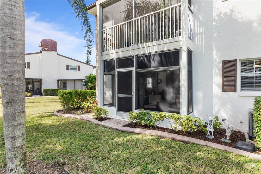 7031 New Post Road, Unit 4 North Fort Myers, FL 33917 - Photo 24 of 39 front view of a house with a yard