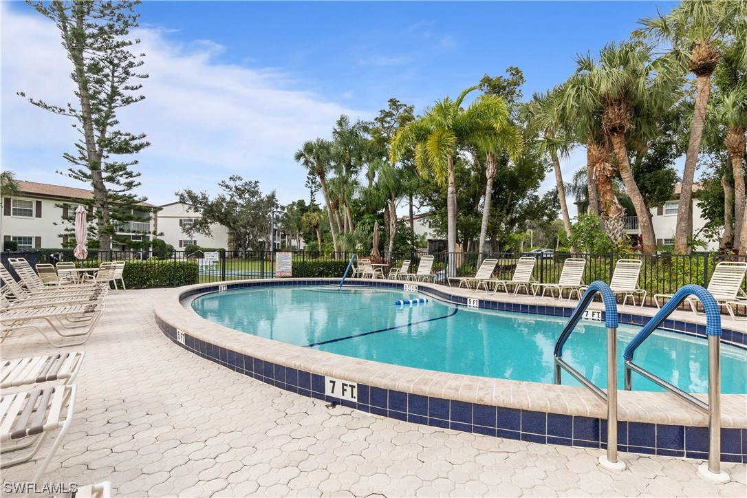 7031 New Post Road, Unit 4 North Fort Myers, FL 33917 - Photo 26 of 39 a view of swimming pool with chairs