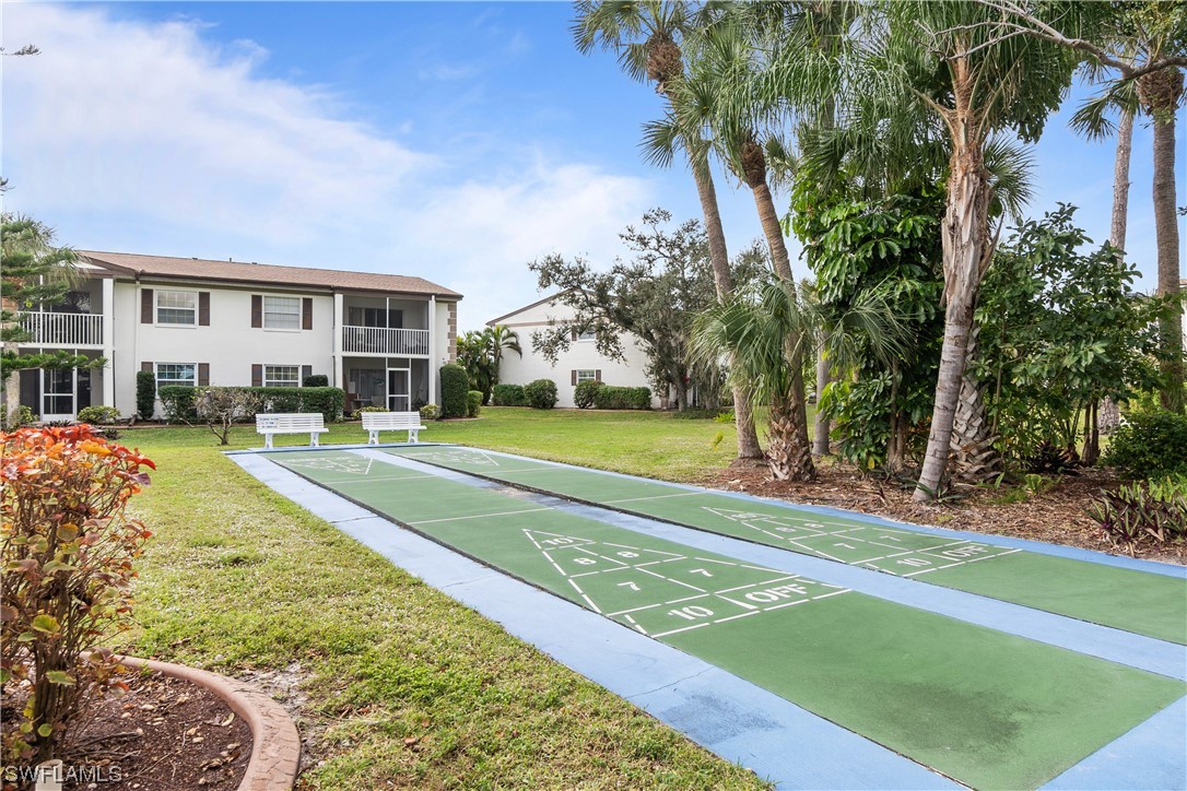 7031 New Post Road, Unit 4 North Fort Myers, FL 33917 - Photo 28 of 39 a view of a house with a big yard and large trees