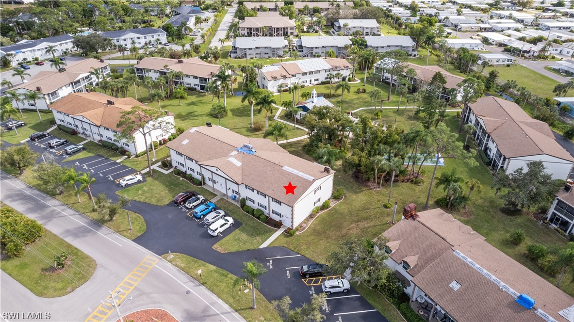 7031 New Post Road, Unit 4 North Fort Myers, FL 33917 - Photo 31 of 39 an aerial view of residential houses with outdoor space
