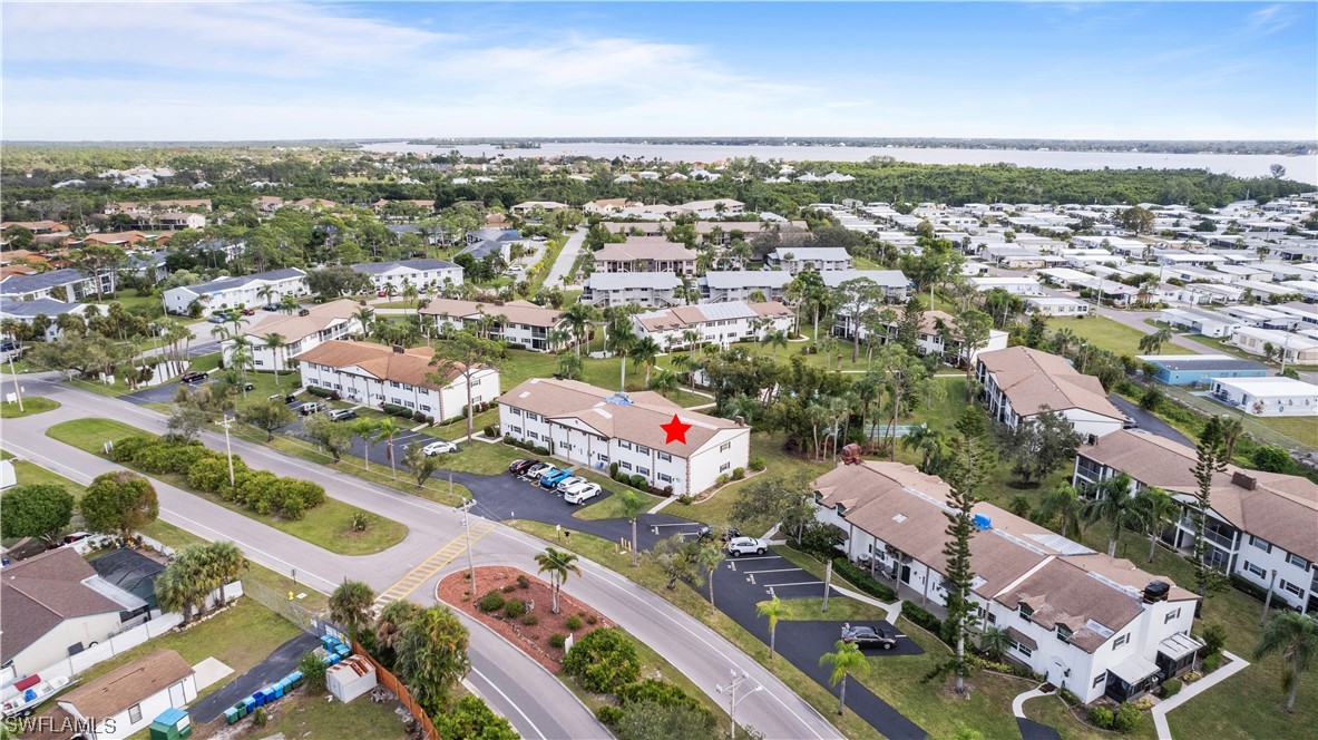 7031 New Post Road, Unit 4 North Fort Myers, FL 33917 - Photo 33 of 39 an aerial view of a city with lots of residential buildings