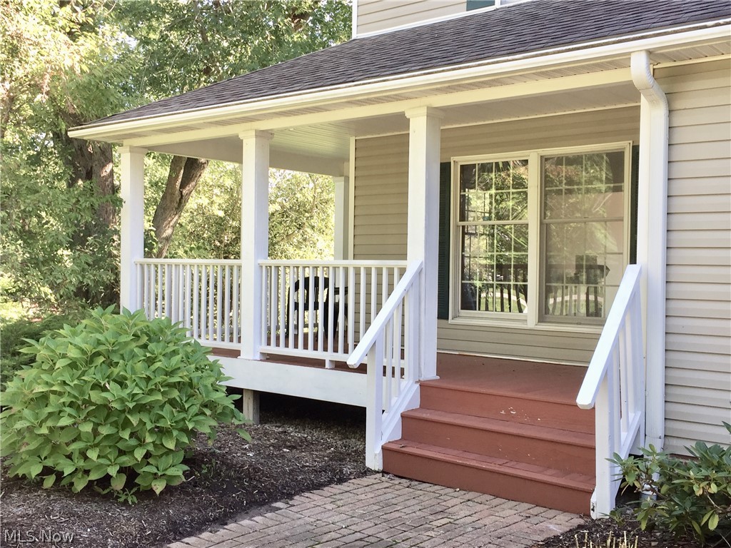 18925 Thorpe Road Chagrin Falls, OH 44023 - Photo 5 of 34 Wrap around porch with white fencing is a great place to relax.