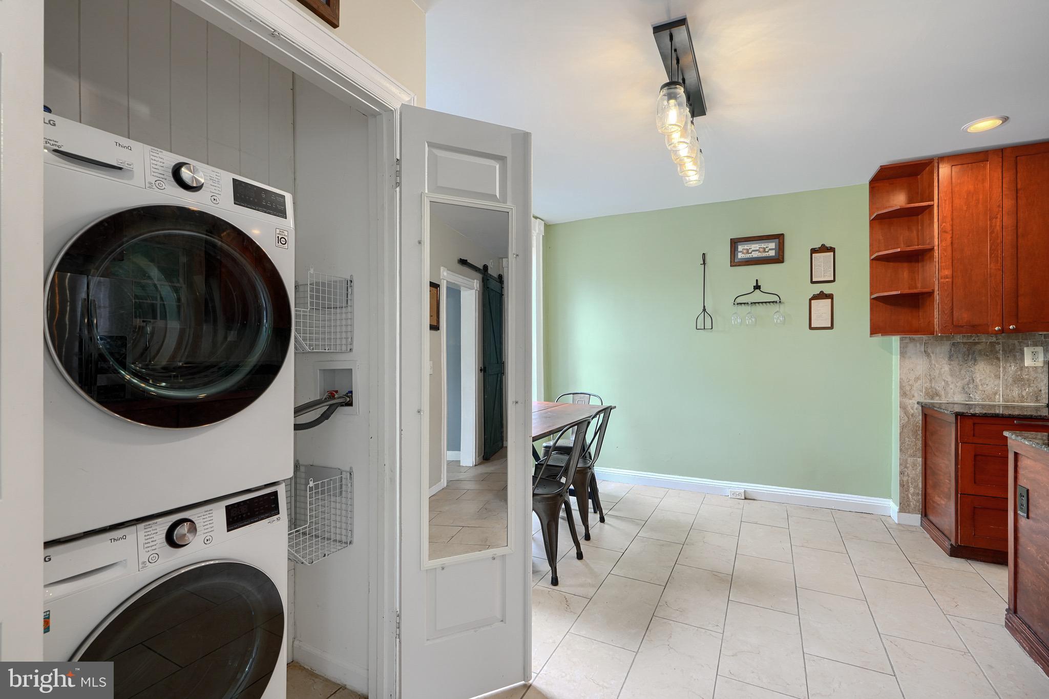 620 Montpelier Street, Unit 1 Baltimore, MD 21218 - Photo 16 of 29 a view of a hallway with washer and dryer