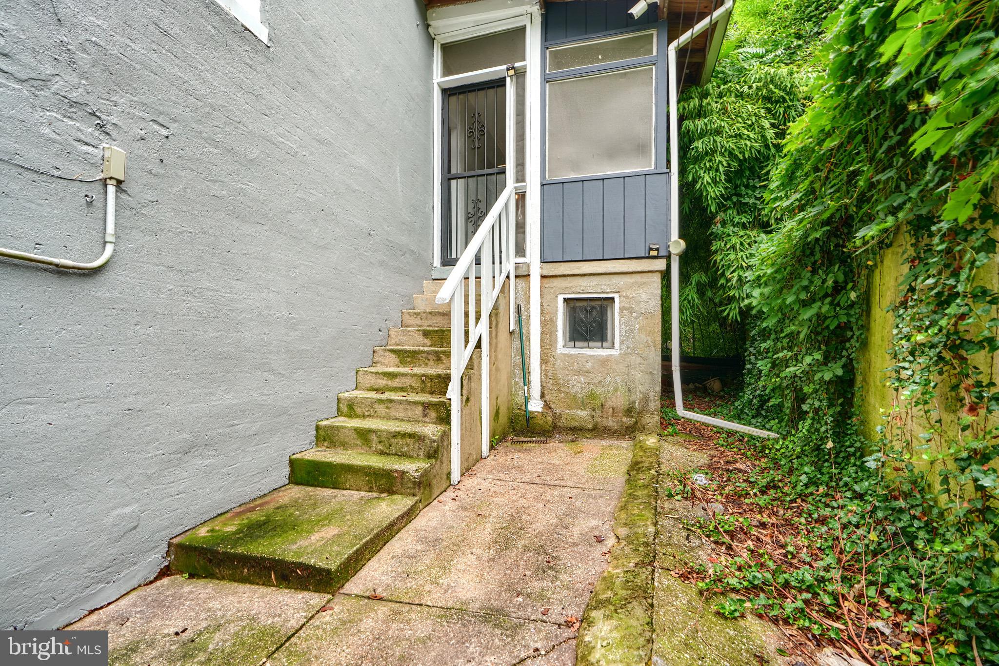 620 Montpelier Street, Unit 1 Baltimore, MD 21218 - Photo 20 of 29 front view of a house with a yard
