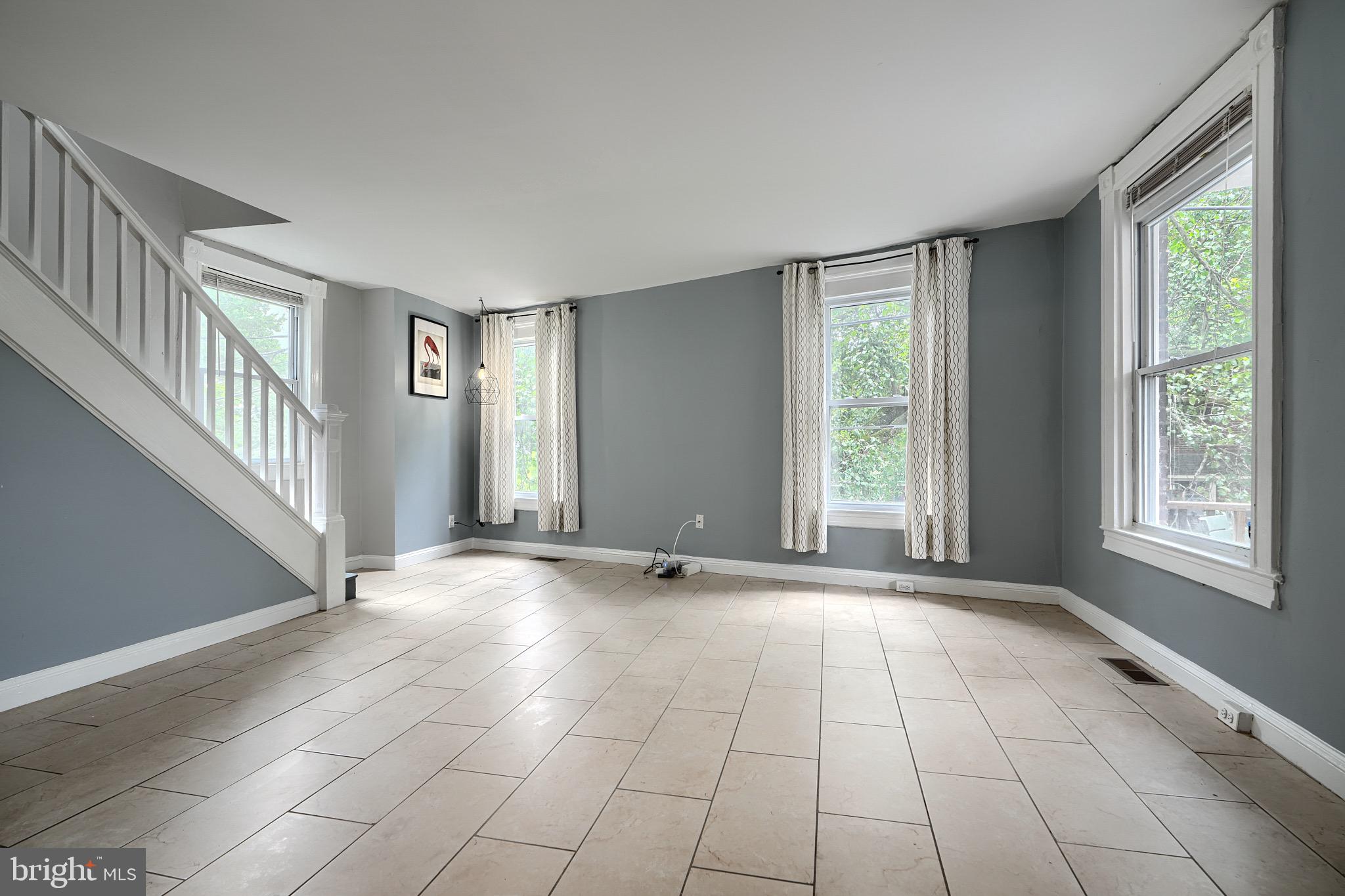 620 Montpelier Street, Unit 1 Baltimore, MD 21218 - Photo 7 of 29 a view of an empty room with windows