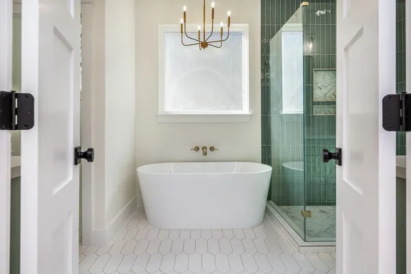 a bathroom with a bathtub and shower