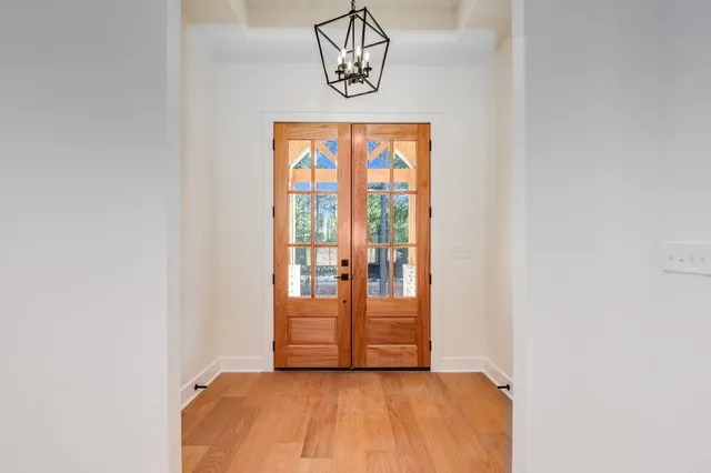 a view of front door with wooden floor