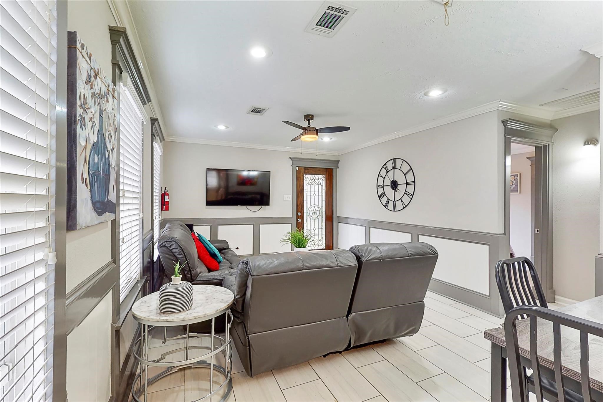 7825 Cook Road Houston, TX 77072 - Photo 2 of 13 a living room with furniture and a flat screen tv