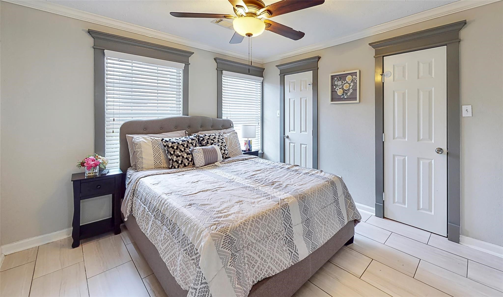 7825 Cook Road Houston, TX 77072 - Photo 10 of 13 a bedroom with a bed and a ceiling fan